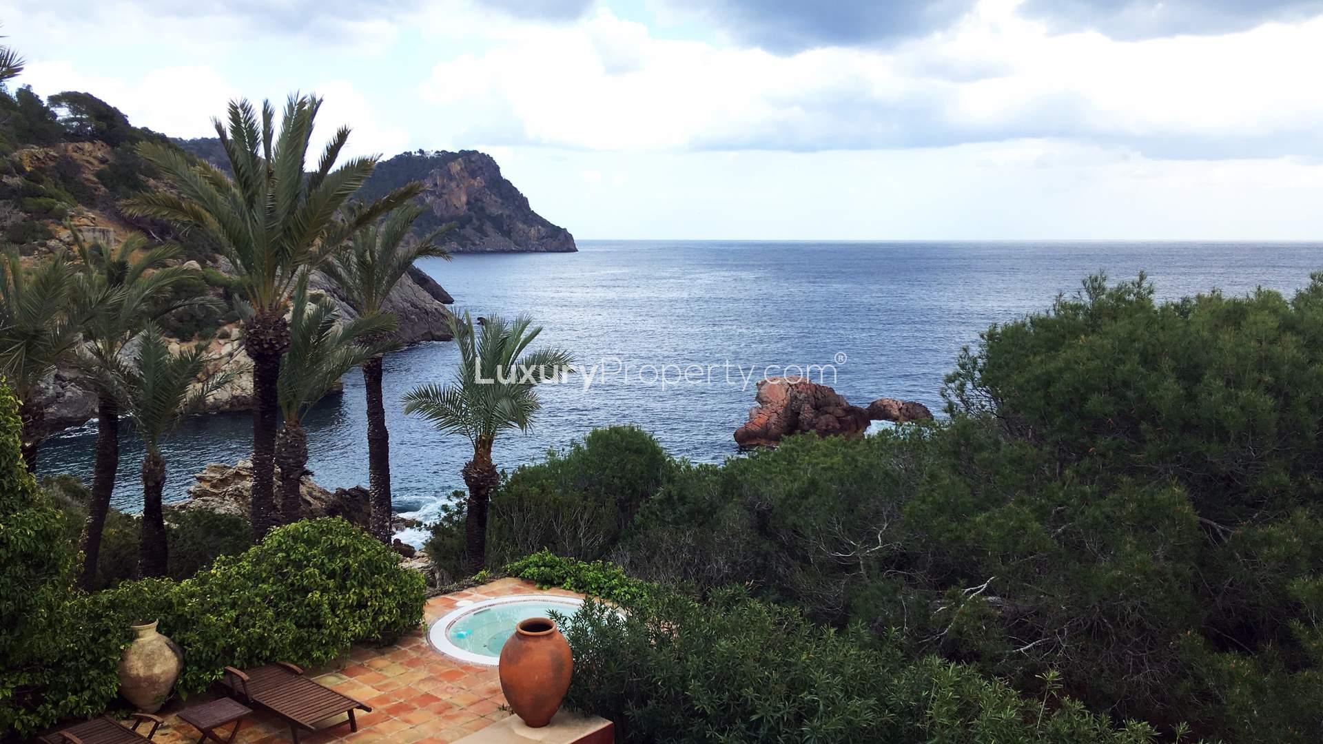 "Cliffside villa with sea views in Cala Mastella, Santa Eulalia Del Rio, for sale.",Stunning cliffside villa with sea views, pool, and lush gardens in Cala Mastella