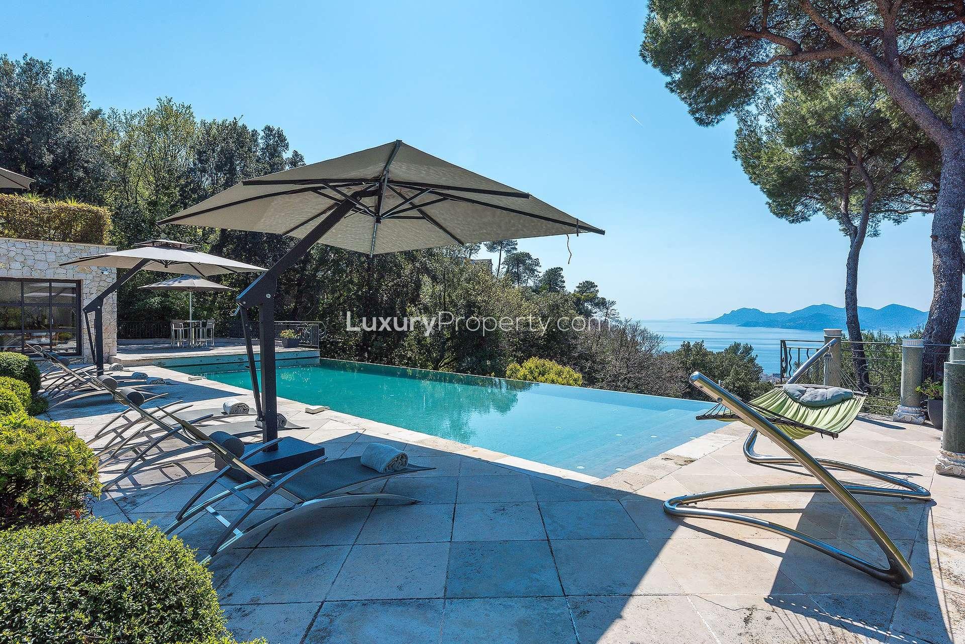 Luxurious villa living room with sea view in Cannes, featuring elegant decor and furnishings