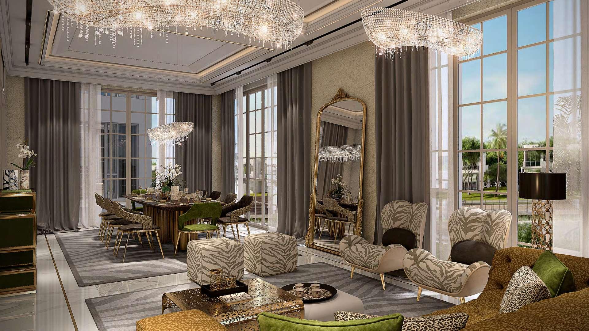 Luxurious living room in Cavalli Estates villa, Damac Hills, featuring elegant decor and chandeliers