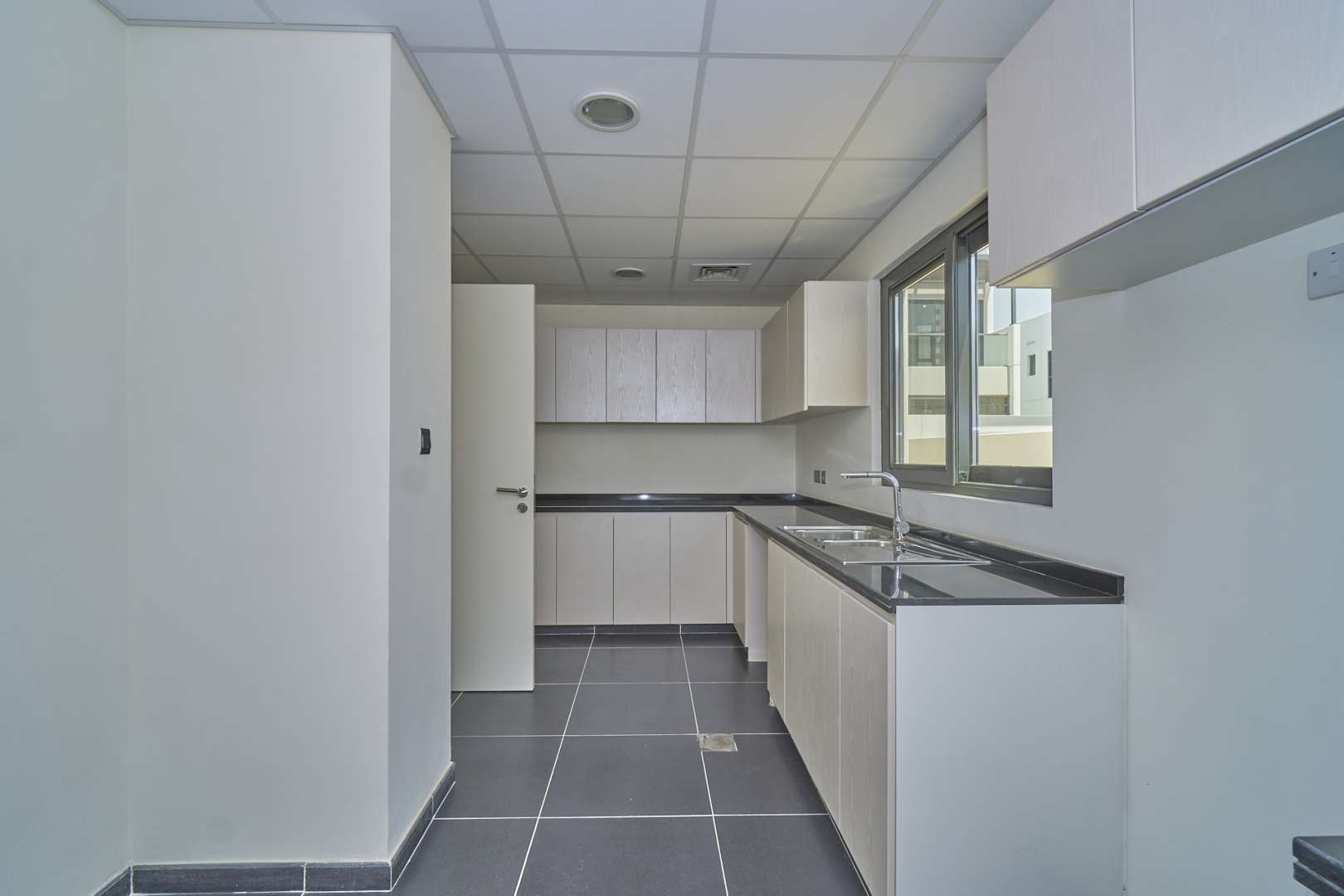 Modern kitchen in six-bedroom villa, Claret, Damac Hills 2, Akoya, for sale