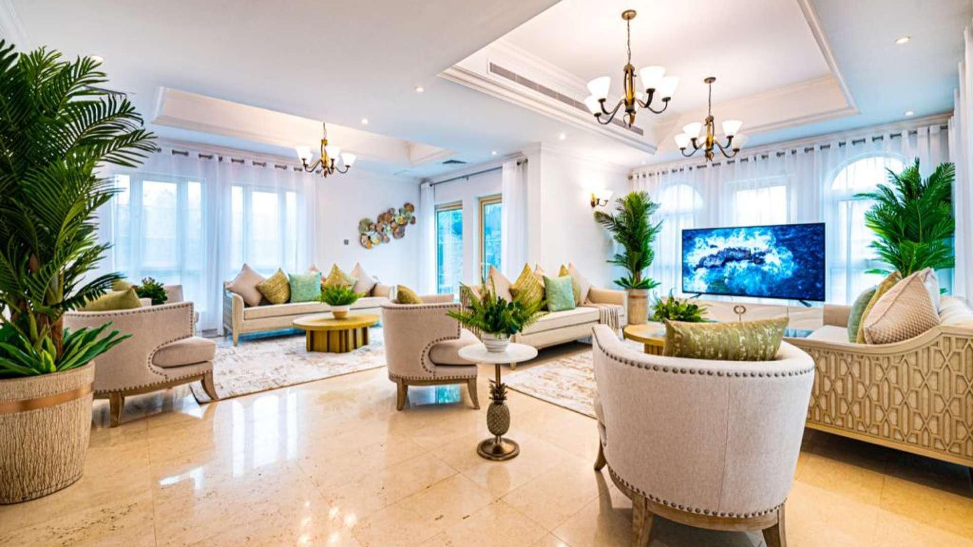 Luxurious living room in furnished Jumeirah Islands villa, elegant decor and modern design