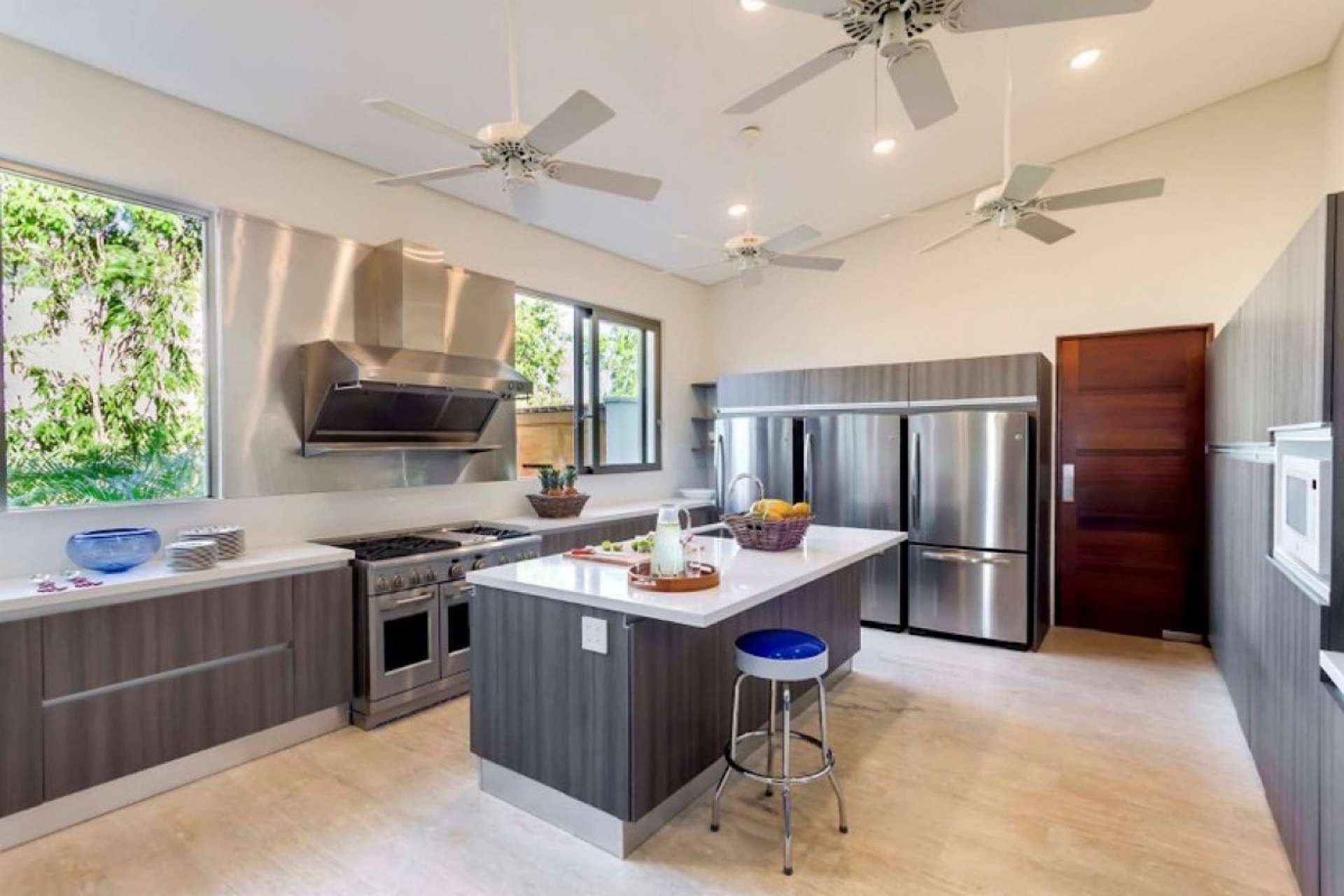Luxurious living room in Casa de Campo villa, featuring modern decor and garden views