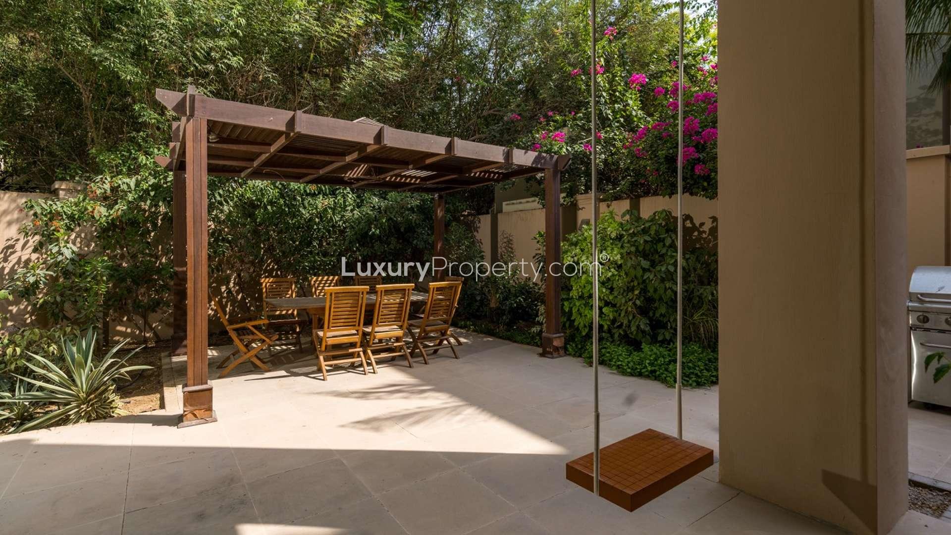 Luxurious poolside view at 6-bedroom Dahlia Villa, Al Barari, Dubai