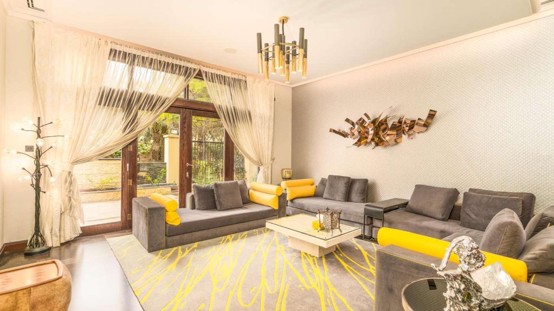 Luxurious bathroom with gold sink and marble wall in Al Barari villa for sale