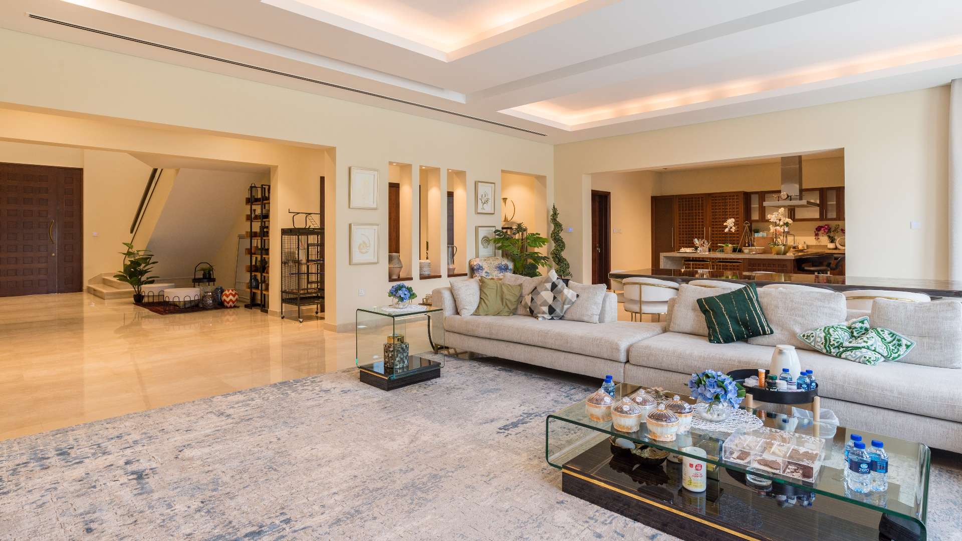 Luxurious living room in 6-bedroom villa, District One, Dubai, with modern decor and spacious layout