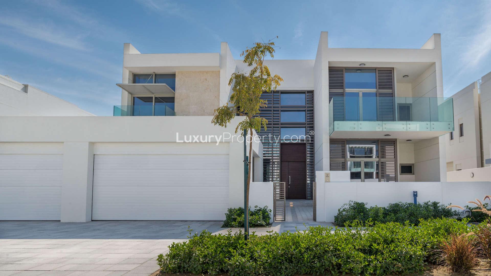 Luxurious villa living room with floor-to-ceiling windows in District One, MBR City