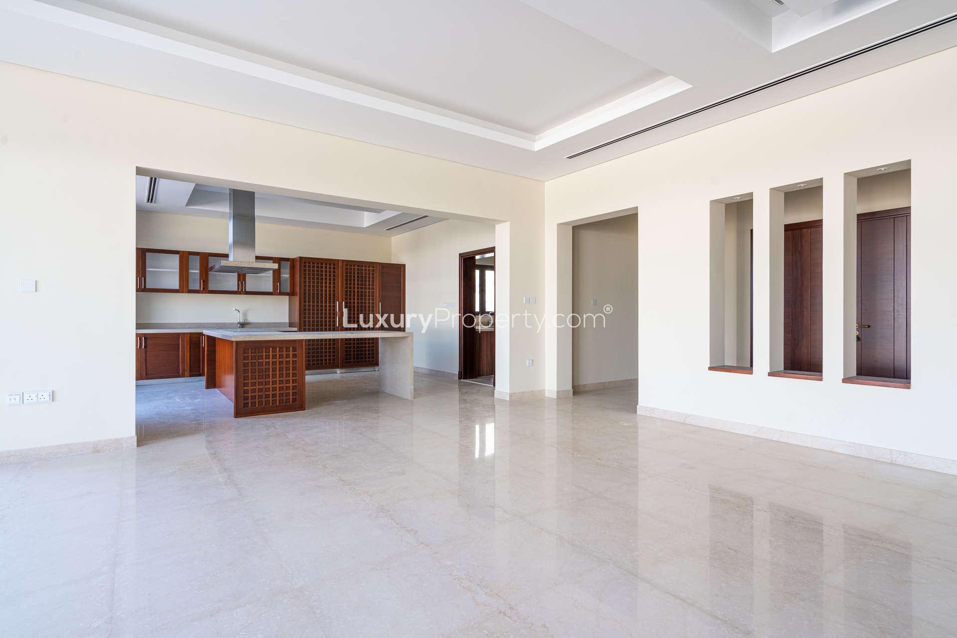 Modern kitchen in 6-bedroom villa, District One, featuring built-in appliances and spacious layout