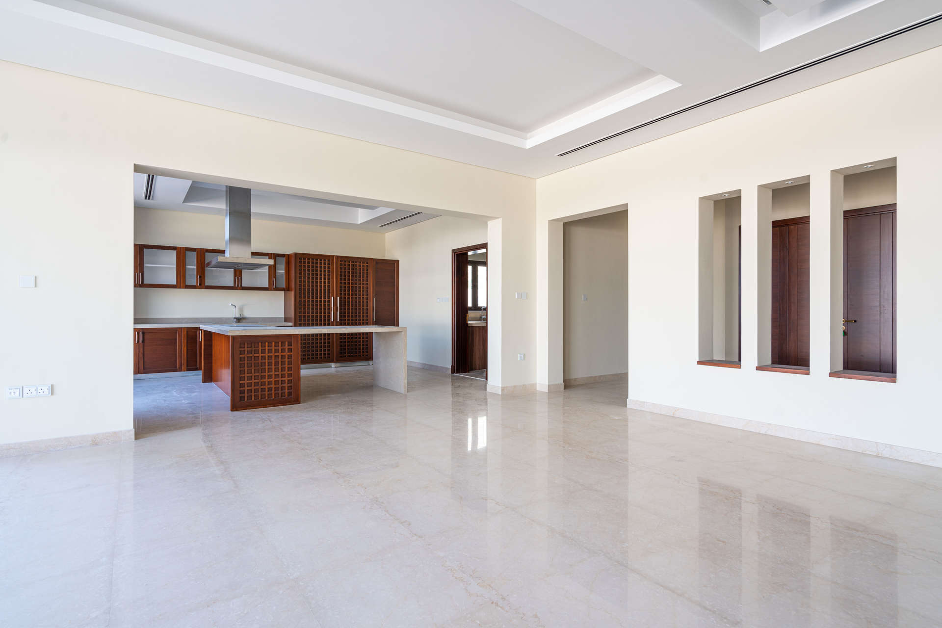 Modern kitchen in 6-bedroom villa, District One, featuring built-in appliances and spacious layout