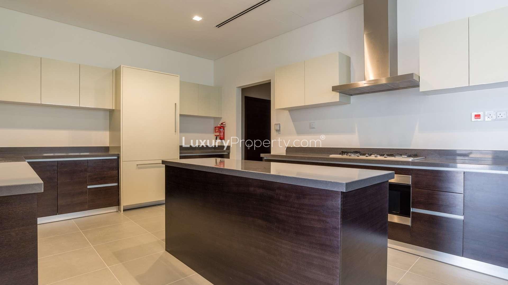 "Spacious villa interior with modern bathroom and large windows in District One, Dubai.",Luxurious bathroom in 6-bedroom villa, District One, Dubai, featuring modern fixtures and design