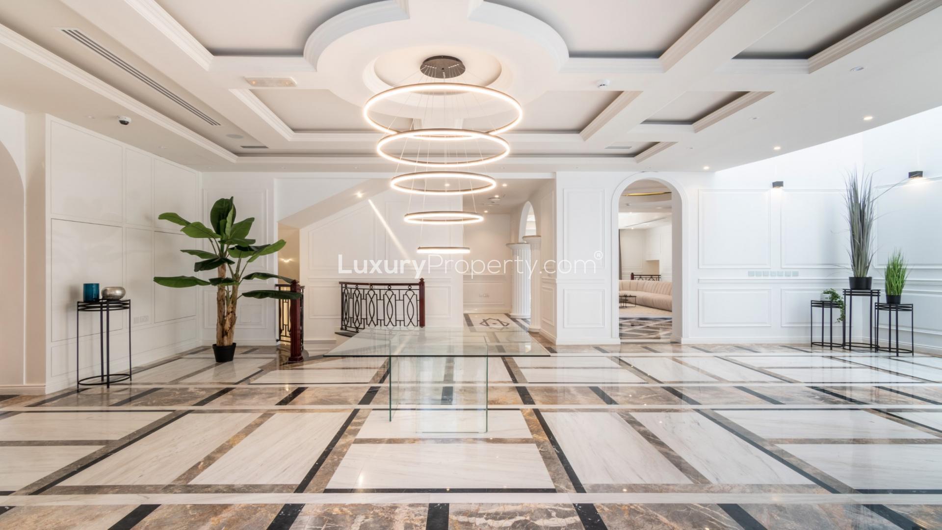 Luxurious villa interior with modern lighting and elegant marble flooring in Jumeirah Golf Estates
