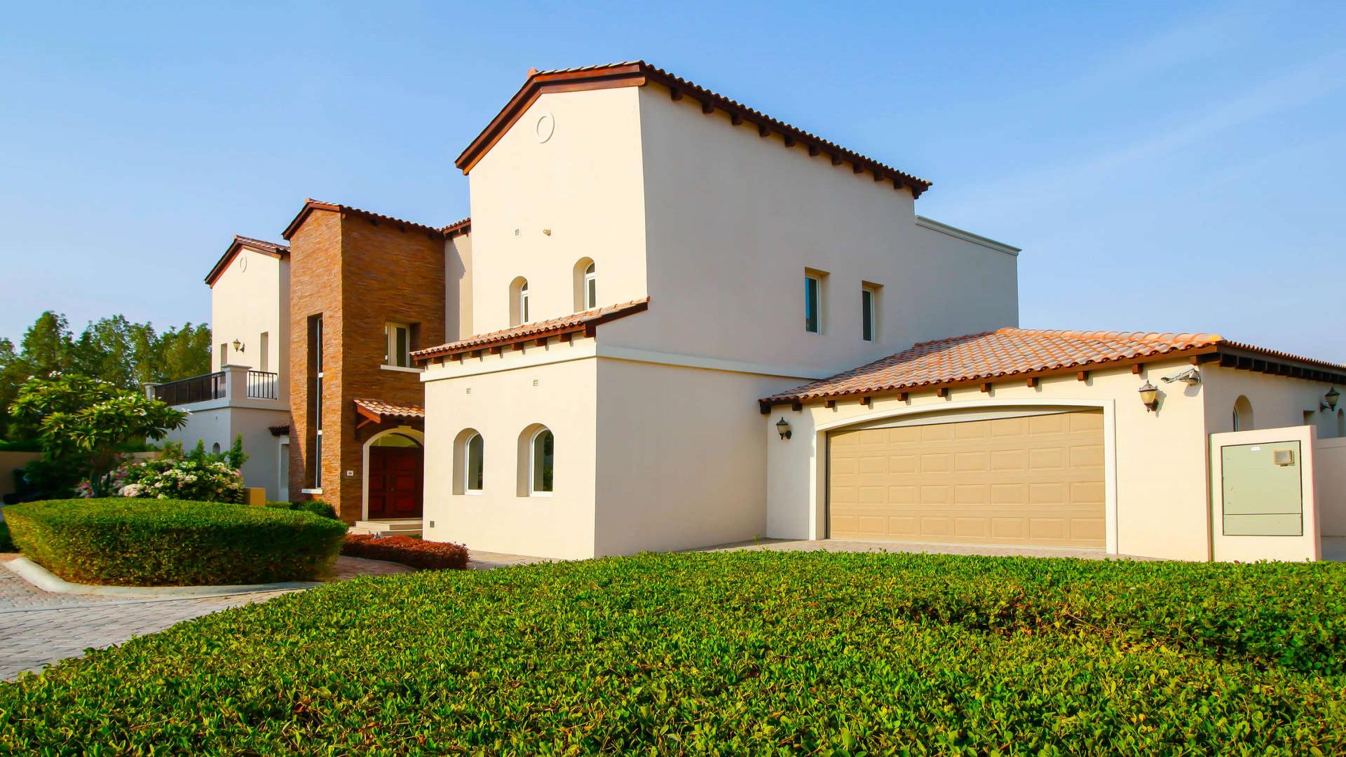 Spacious living area in newly refurnished villa, Jumeirah Golf Estates, overlooking lush garden