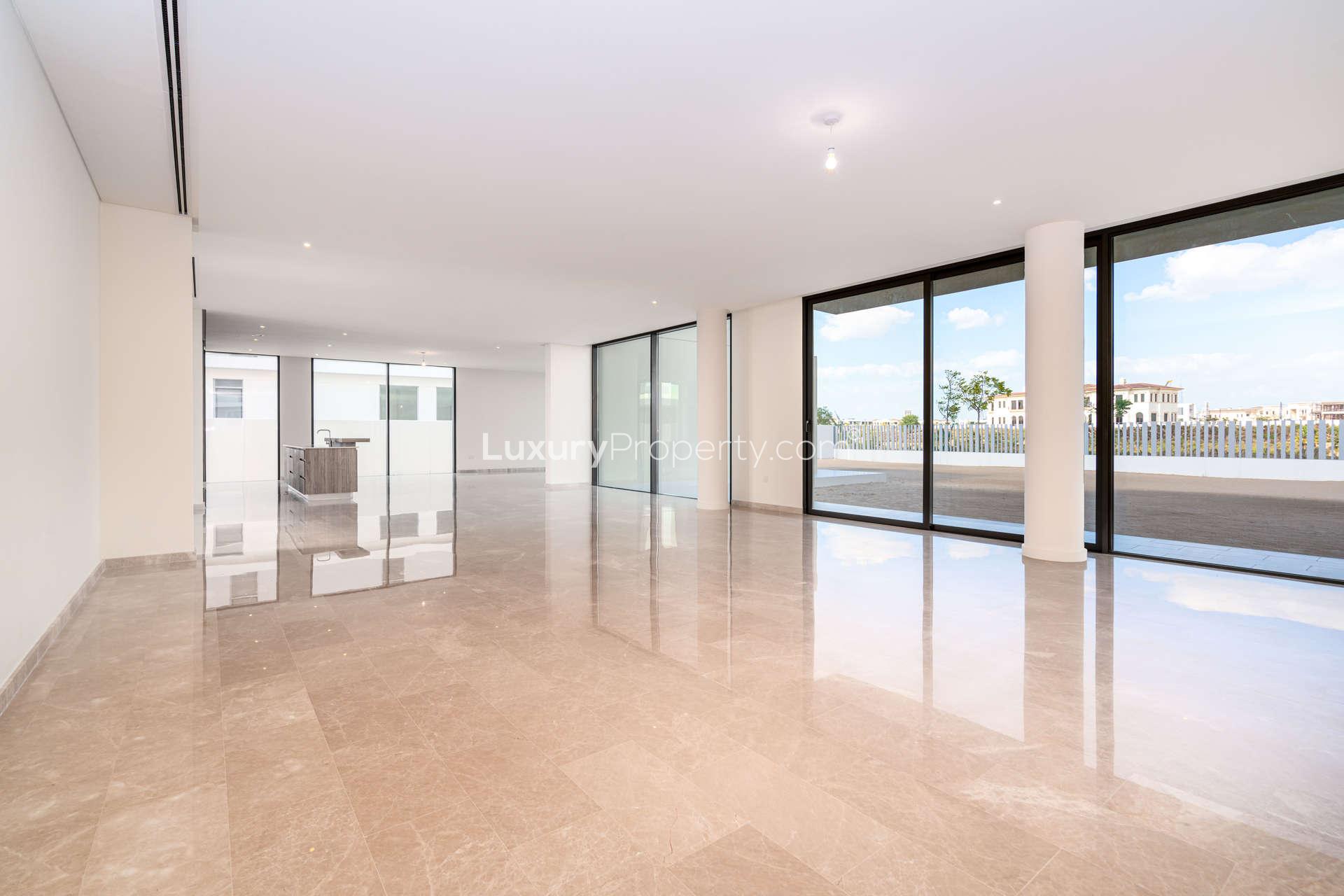 Modern kitchen with wooden cabinets in Dubai Hills Estate villa for sale