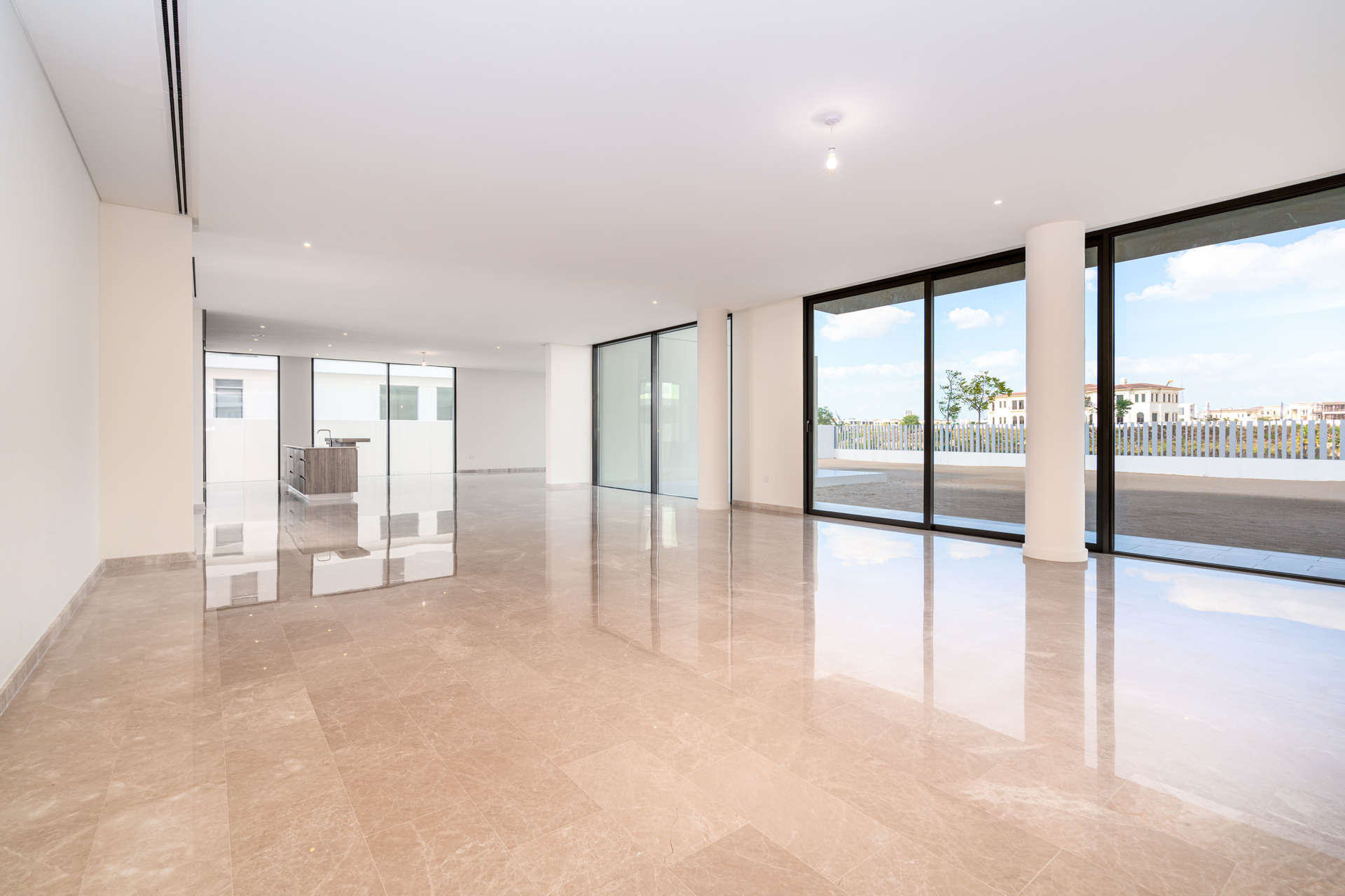 Modern kitchen with wooden cabinets in Dubai Hills Estate villa for sale