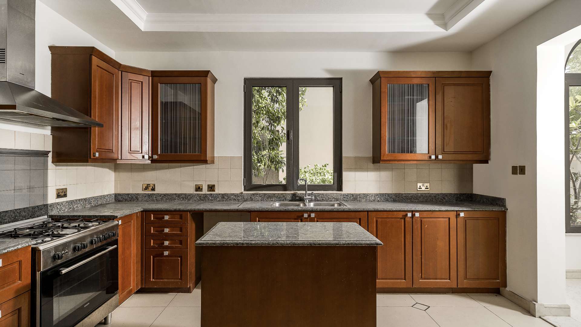 Luxurious kitchen in Palm Jumeirah villa, featuring modern appliances and elegant cabinetry