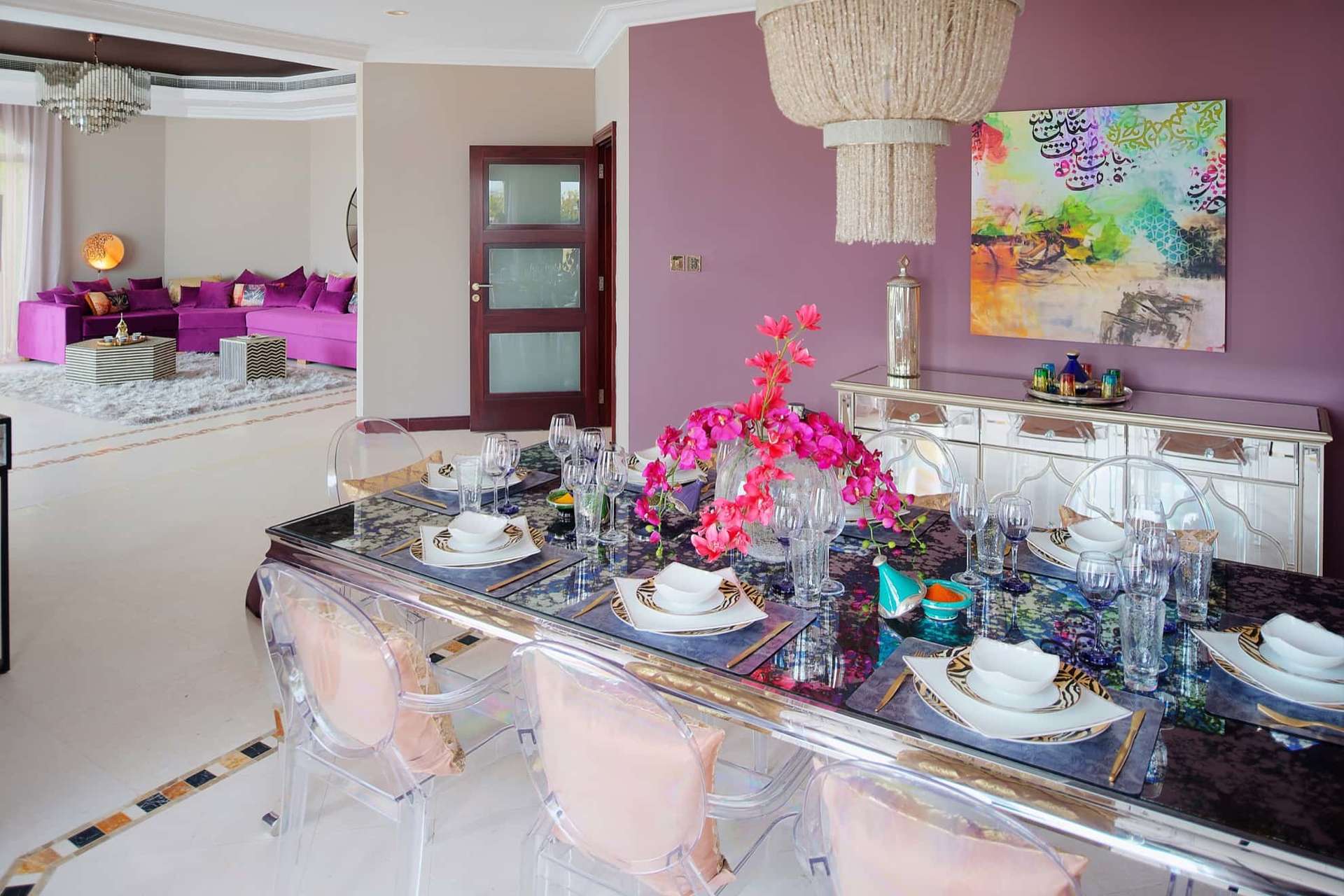 Elegant living room in six-bedroom villa, Palm Jumeirah, featuring luxurious purple sofa and decor