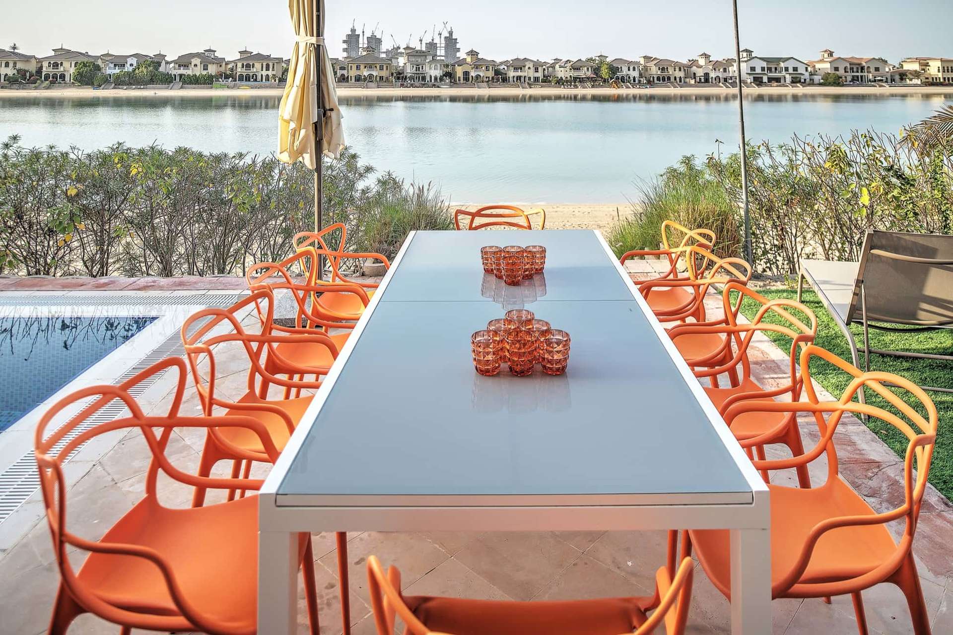 Colorful living room in Mediterranean villa, Palm Jumeirah, with pool and waterfront views