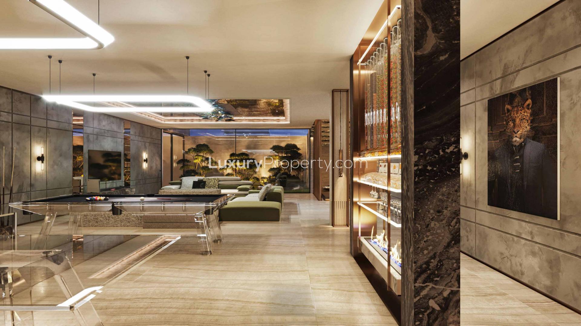 Luxurious living room in Damac Hills villa with modern decor and elegant chandelier