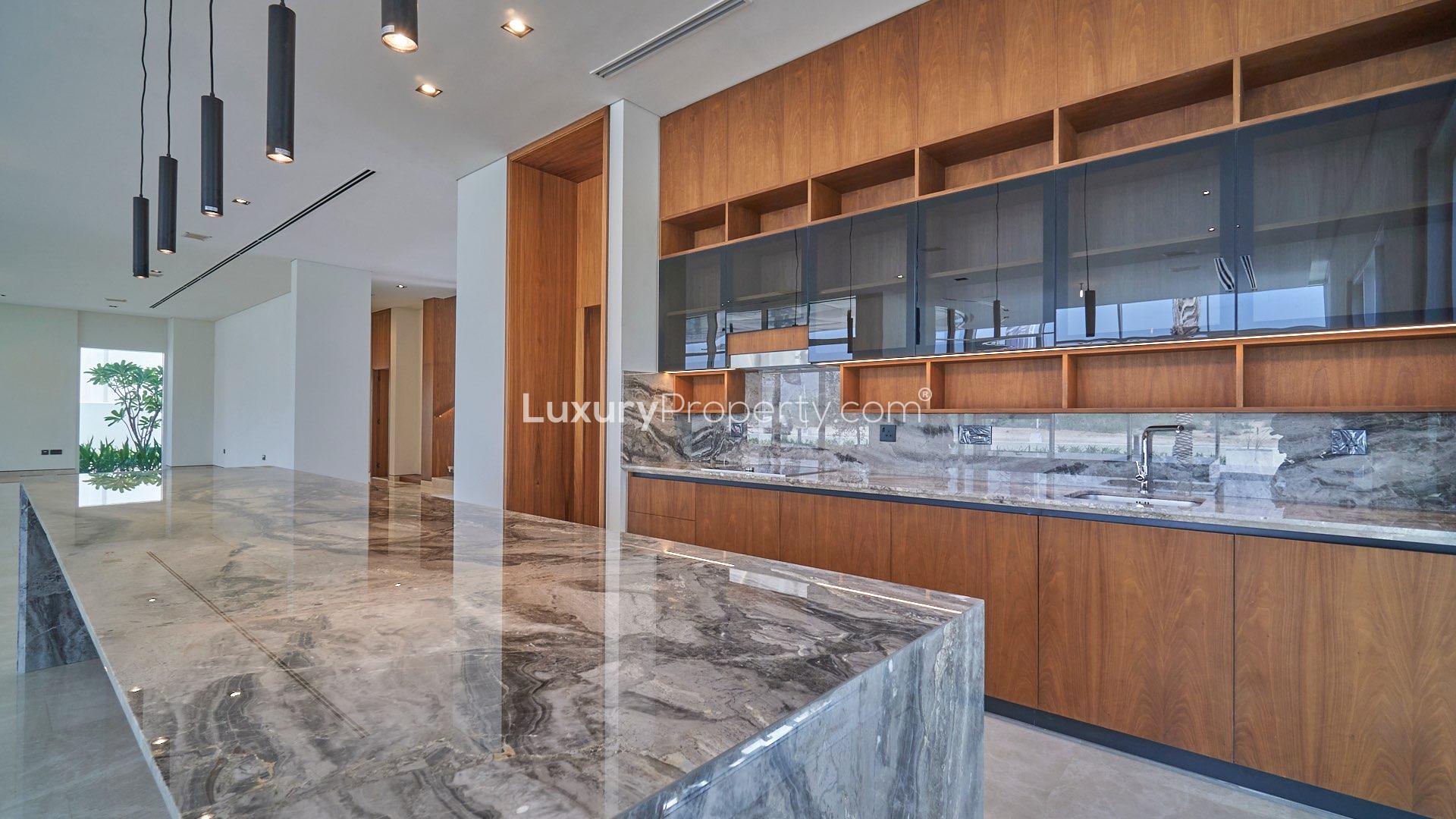 Modern bathroom with marble finishes in Dubai Hills Estate villa, featuring sleek vanity and shower
