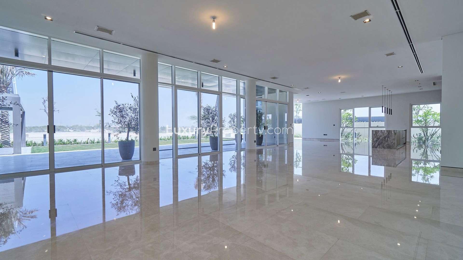 "Spacious bedroom with wooden closets in 6-bedroom villa, Golf Place, Dubai Hills Estate.",Spacious interior of elegant 6-bedroom villa at Golf Place, Dubai Hills Estate