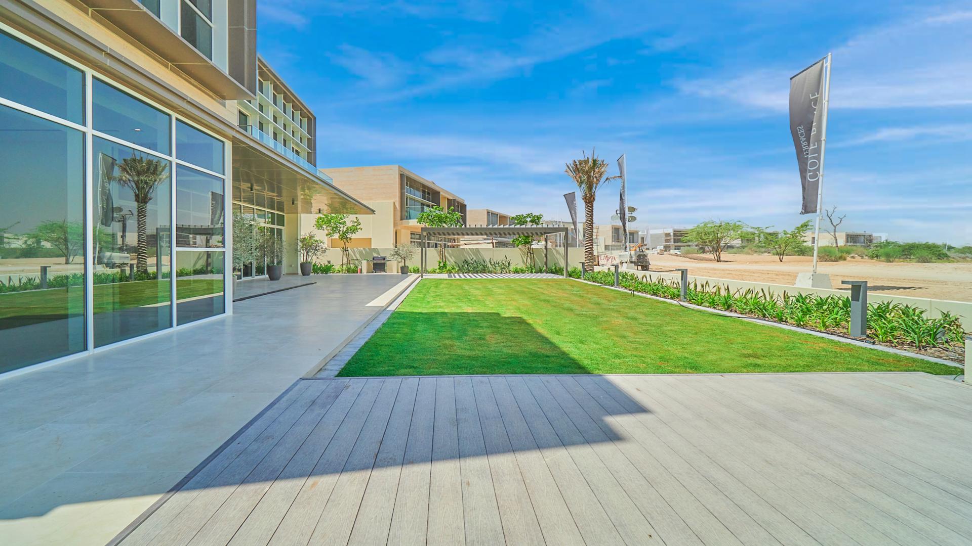 Modern villa exterior with lush garden in Dubai Hills Estate, Golf Place community