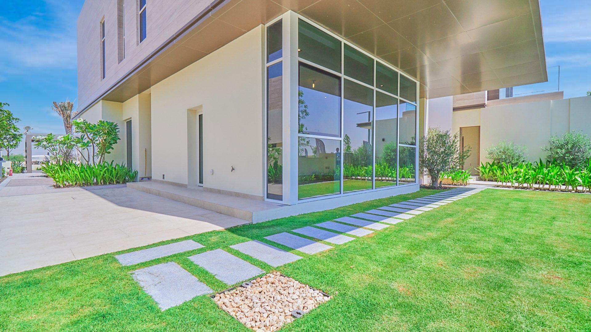 Spacious villa interior with large windows and park view in Dubai Hills Estate