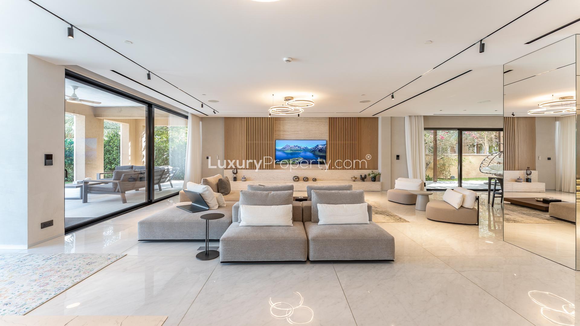 Luxurious villa poolside at night with city skyline view, Palm Jumeirah, Kingdom of Sheba