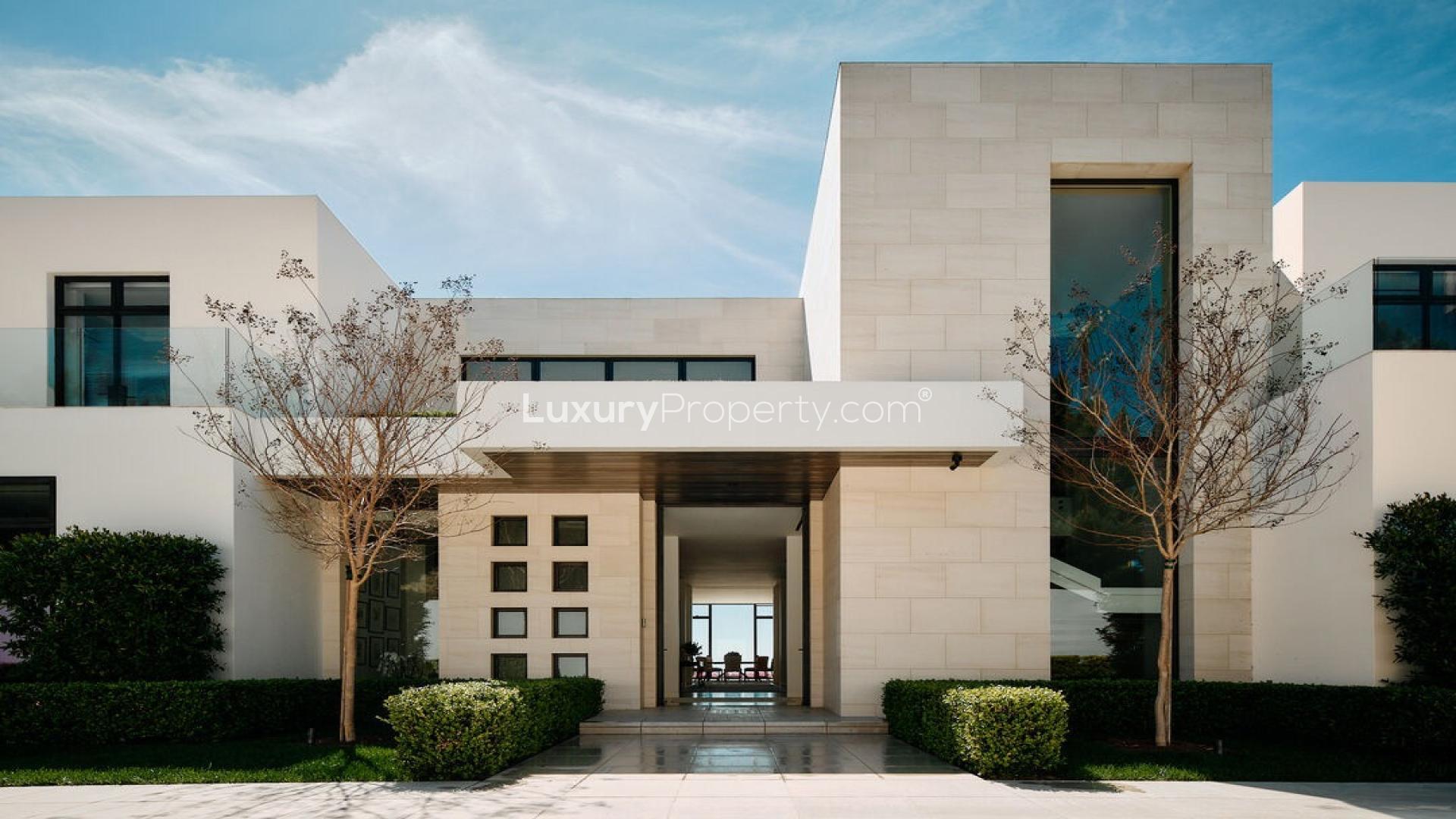 Luxurious Beverly Hills villa with pool, spacious outdoor area, and modern architecture at sunset