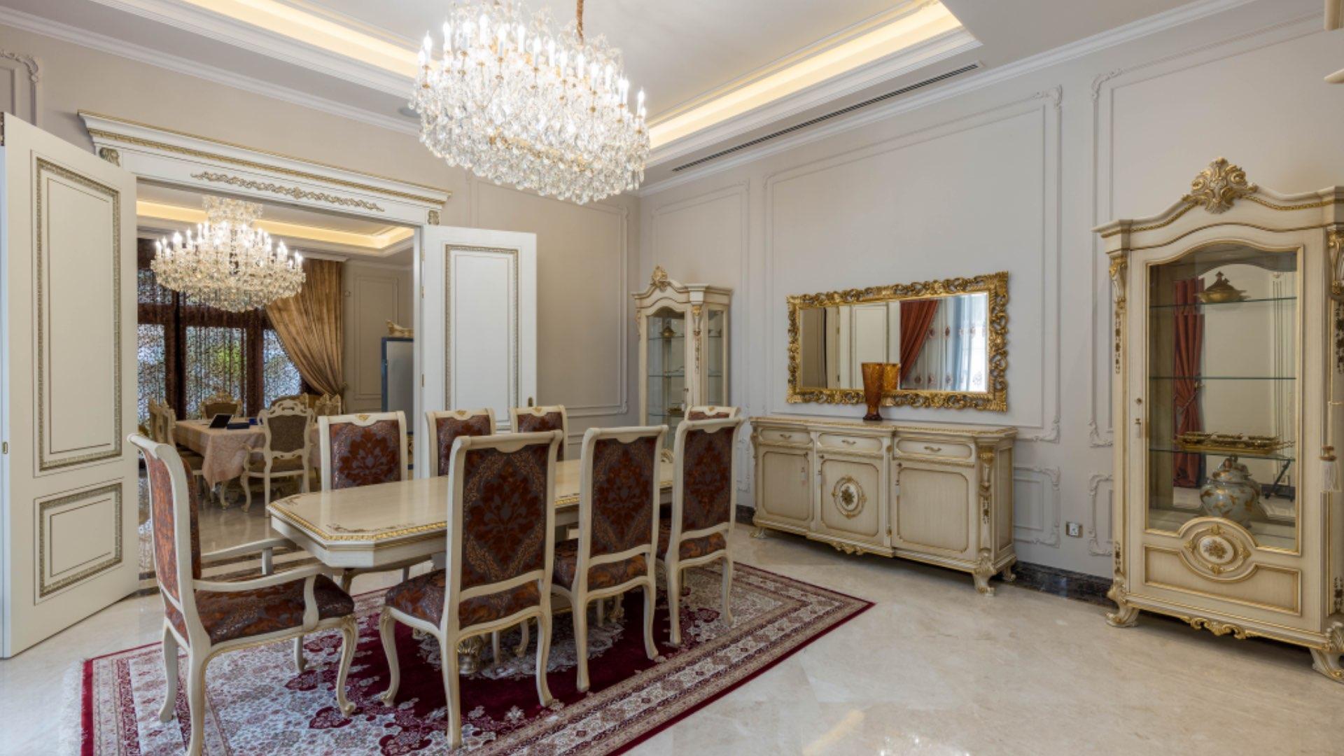 N/A,Luxurious dining room with elegant chandelier in Al Barari villa for sale