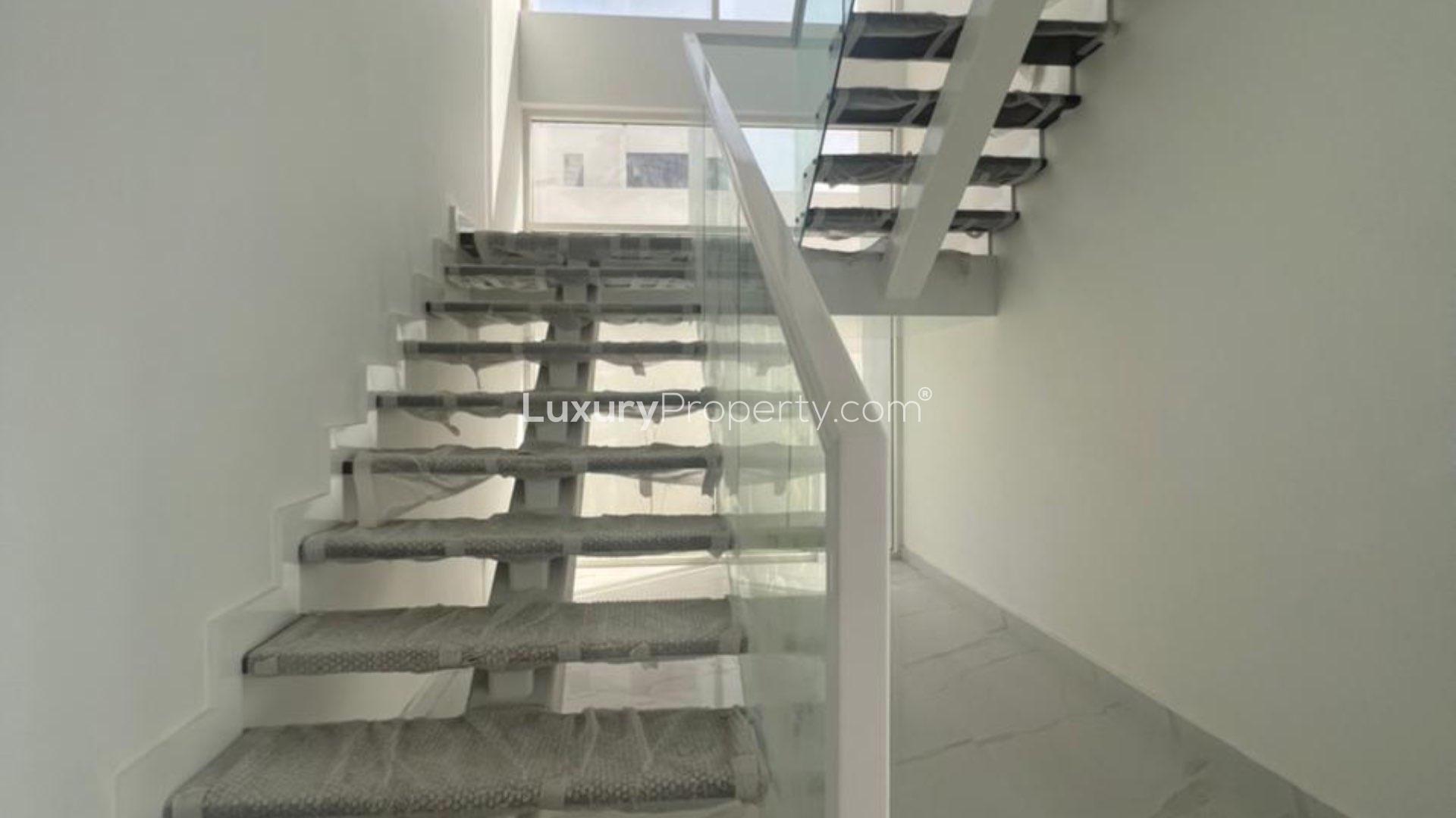 Modern living room with large windows in Jumeirah Park villa for sale, LP13099