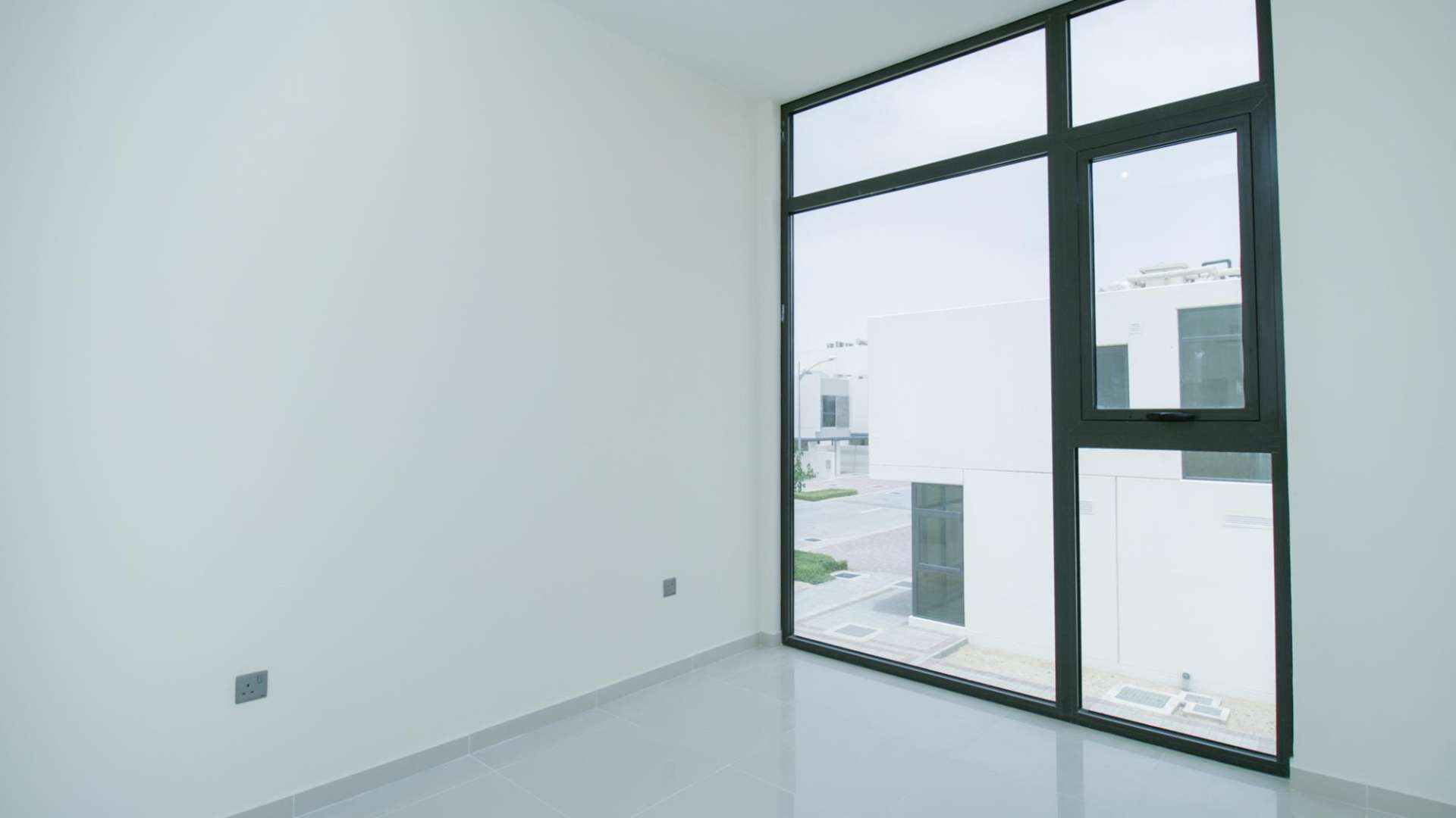 Bright bedroom with built-in wardrobe in six-bedroom villa, Juniper, Damac Hills 2, Akoya