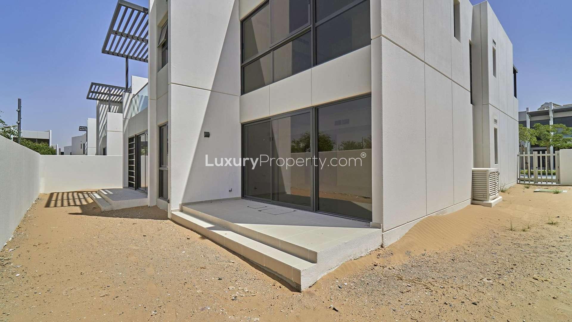 Modern 6-bed villa exterior in Juniper, Damac Hills 2, with park and pool view