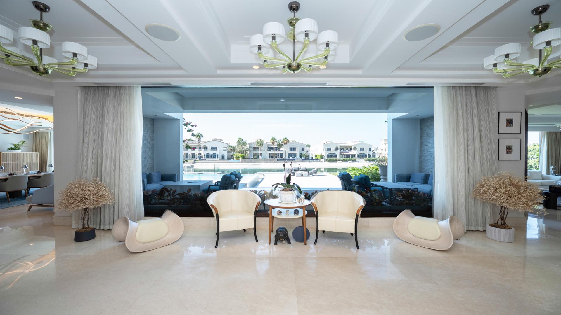 N/A,Luxury Italian-style villa interior with pool view at Palm Jumeirah, Signature Villas