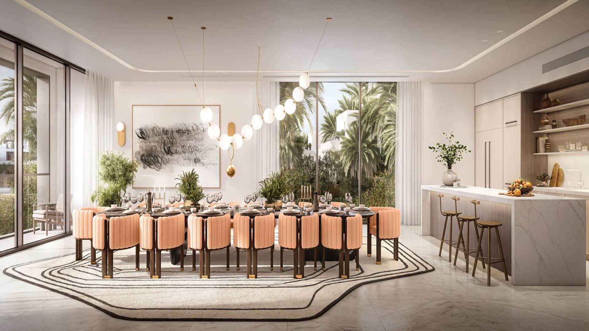 Luxury waterfront villa dining room with garden view in The Oasis by Emaar