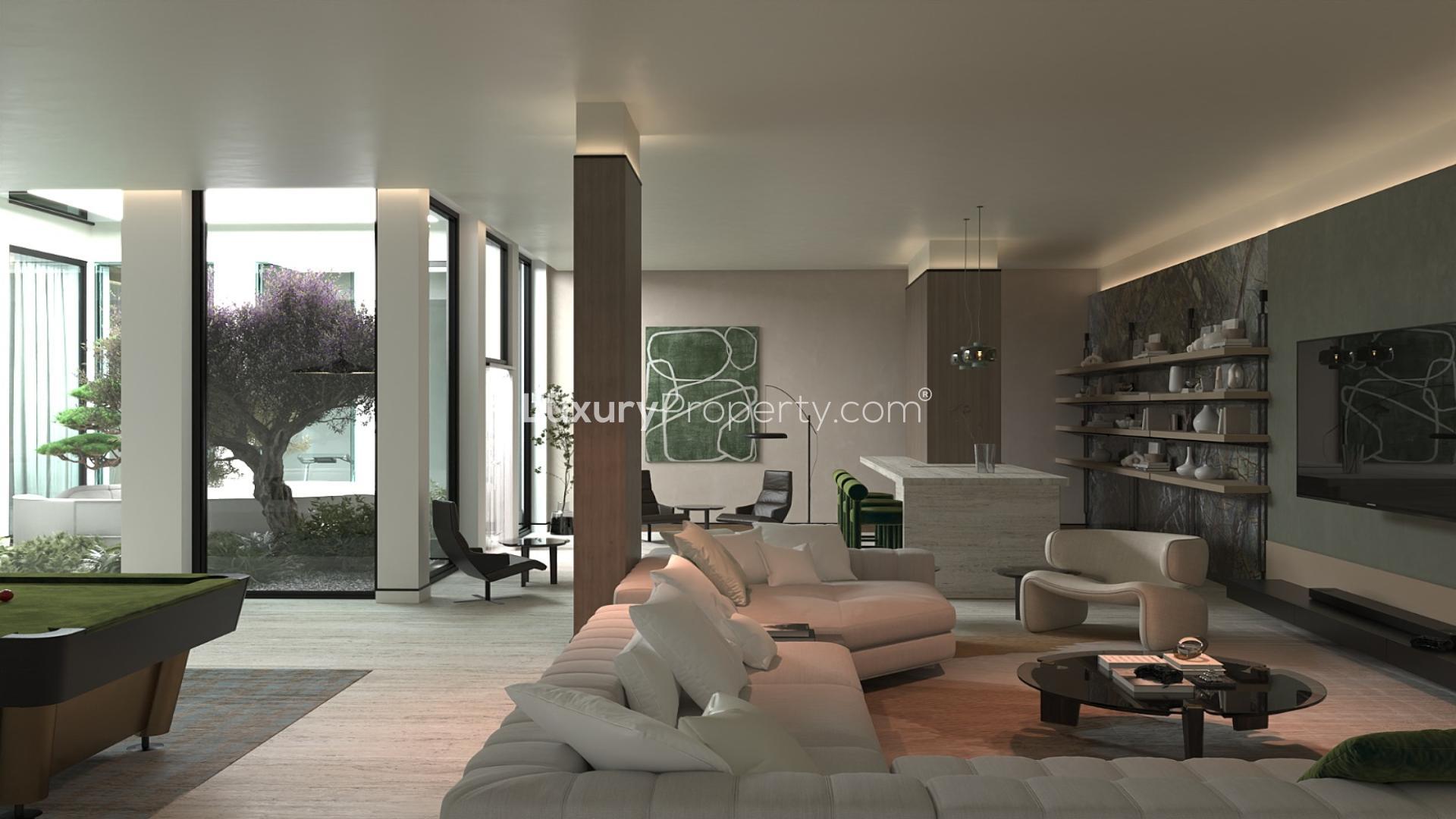 Modern kitchen and living area in luxurious Jumeirah Golf Estates villa, Fire community