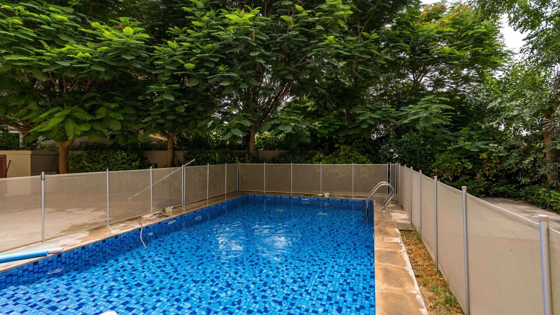 Luxurious Tarragona villa exterior with lush garden in Jumeirah Golf Estates, Lime Tree Valley