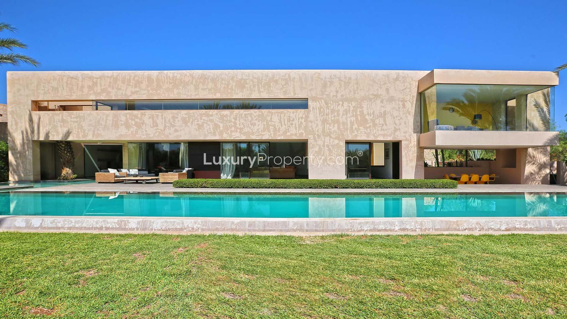 Luxurious Villa Nor in Marrakech with pool, palm trees, and modern architecture for sale
