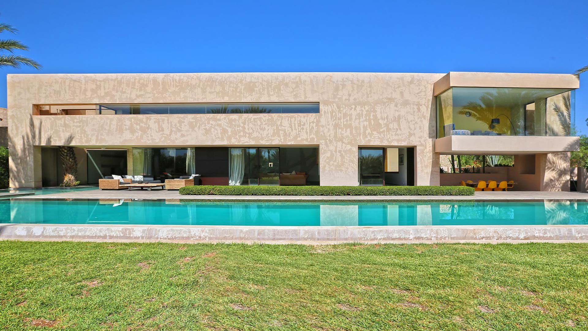Luxurious Villa Nor in Marrakech with pool, palm trees, and modern architecture for sale