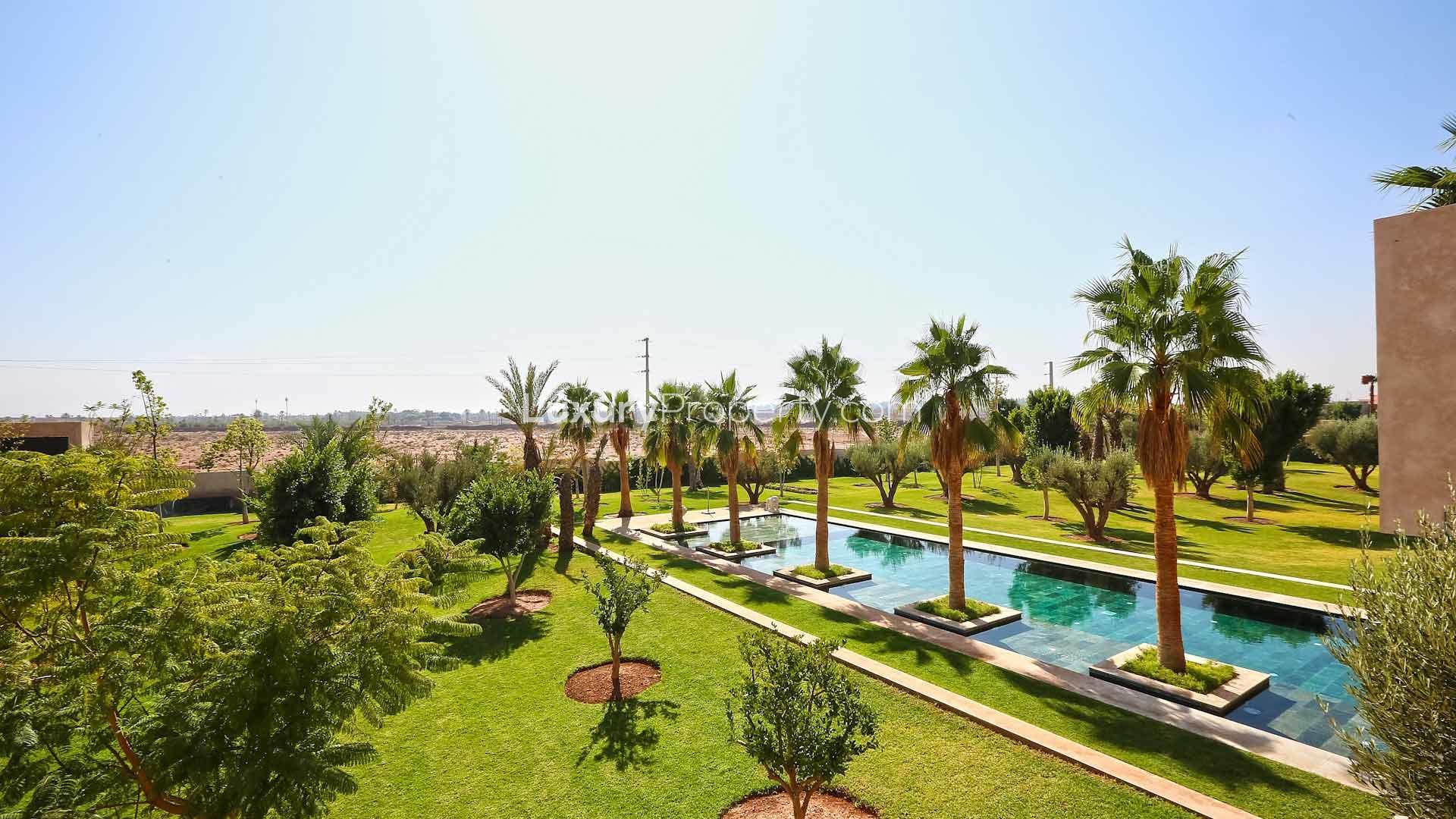 Luxurious pool and garden view at Villa Soli, Palmeraie, Marrakech, for sale