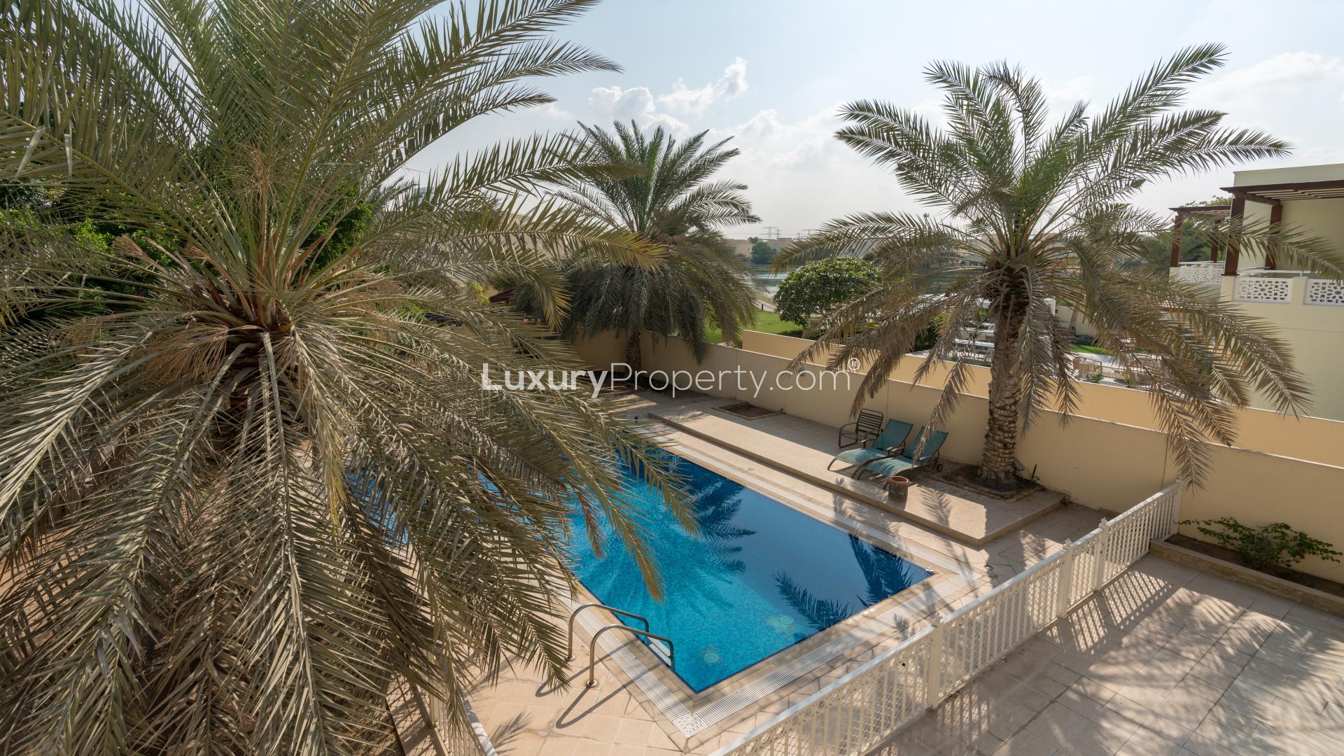 Luxurious 6-bedroom villa with pool, lush garden, and palm trees in Meadows 9