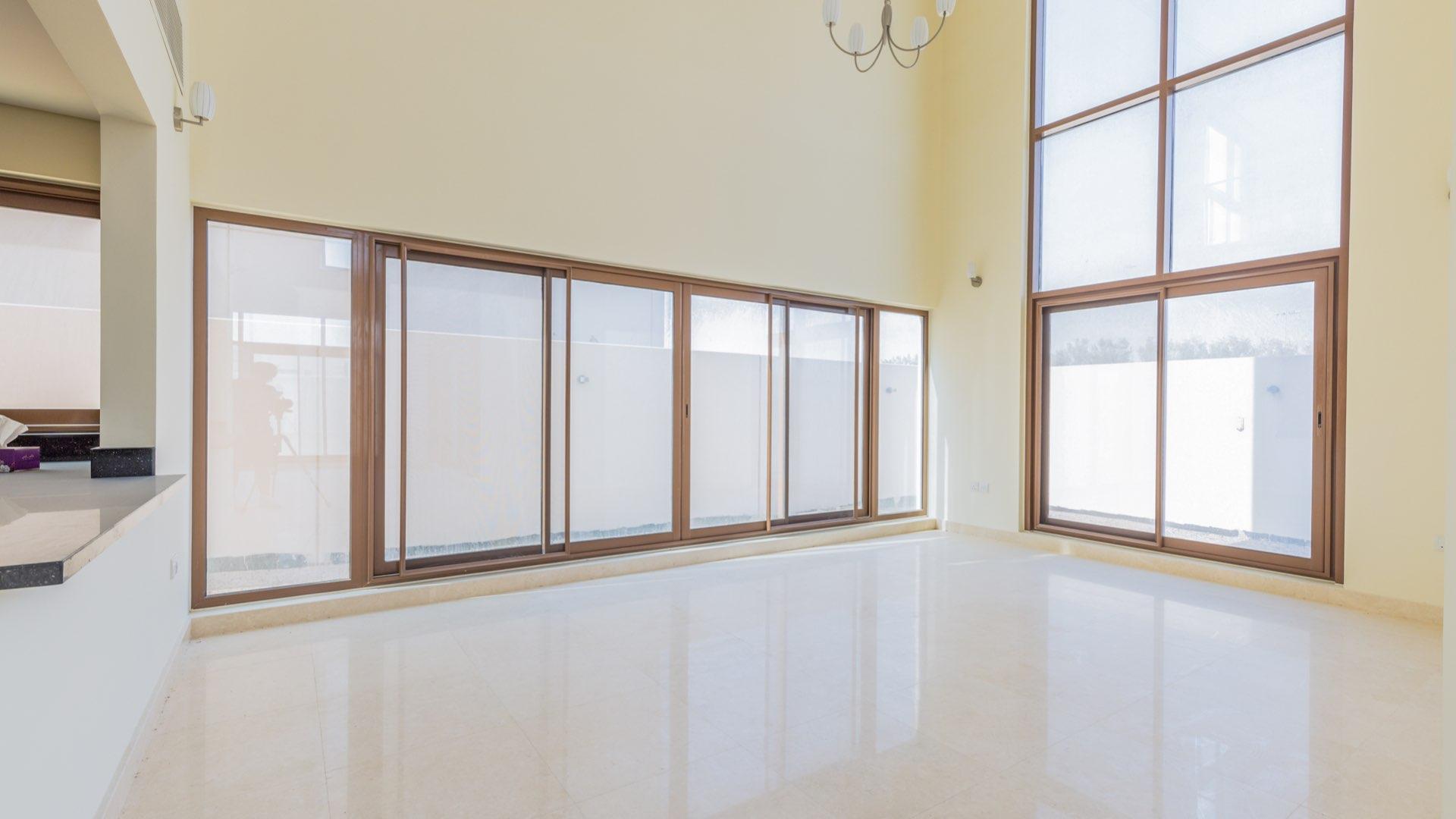 Spacious living area in 6-bedroom villa, Grand Views, Meydan, featuring modern open-plan design