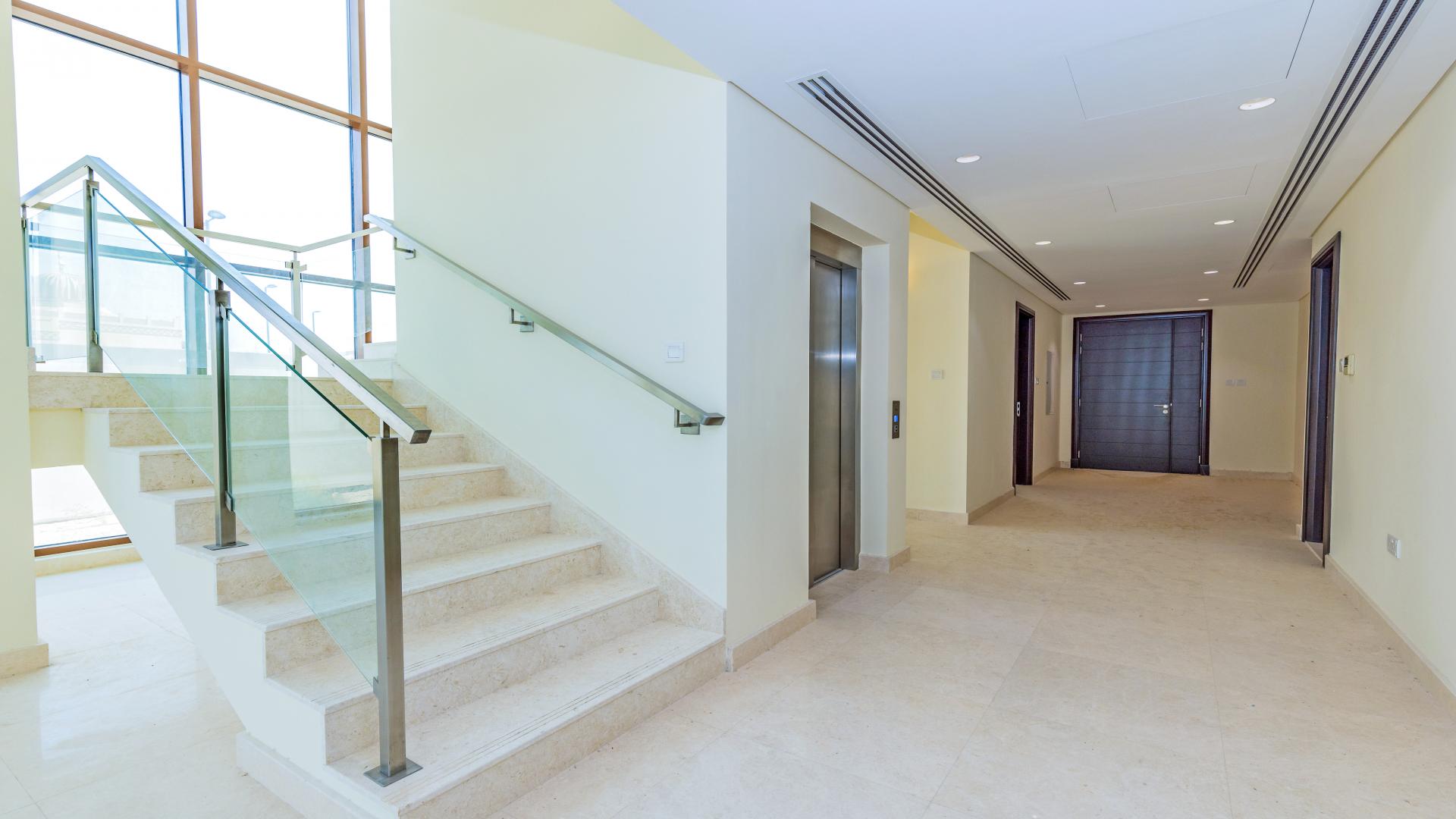 Staircase and elevator area in luxurious Meydan villa for sale, Grand Views community