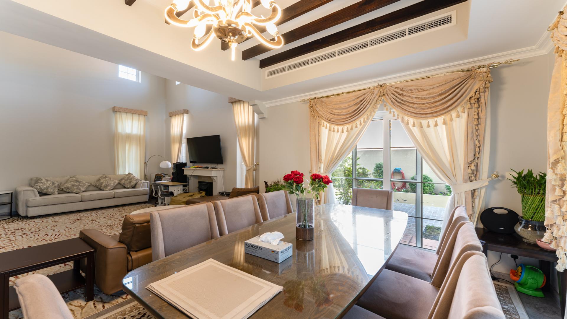 Balcony view of private garden and pool in Arabian Ranches villa for sale