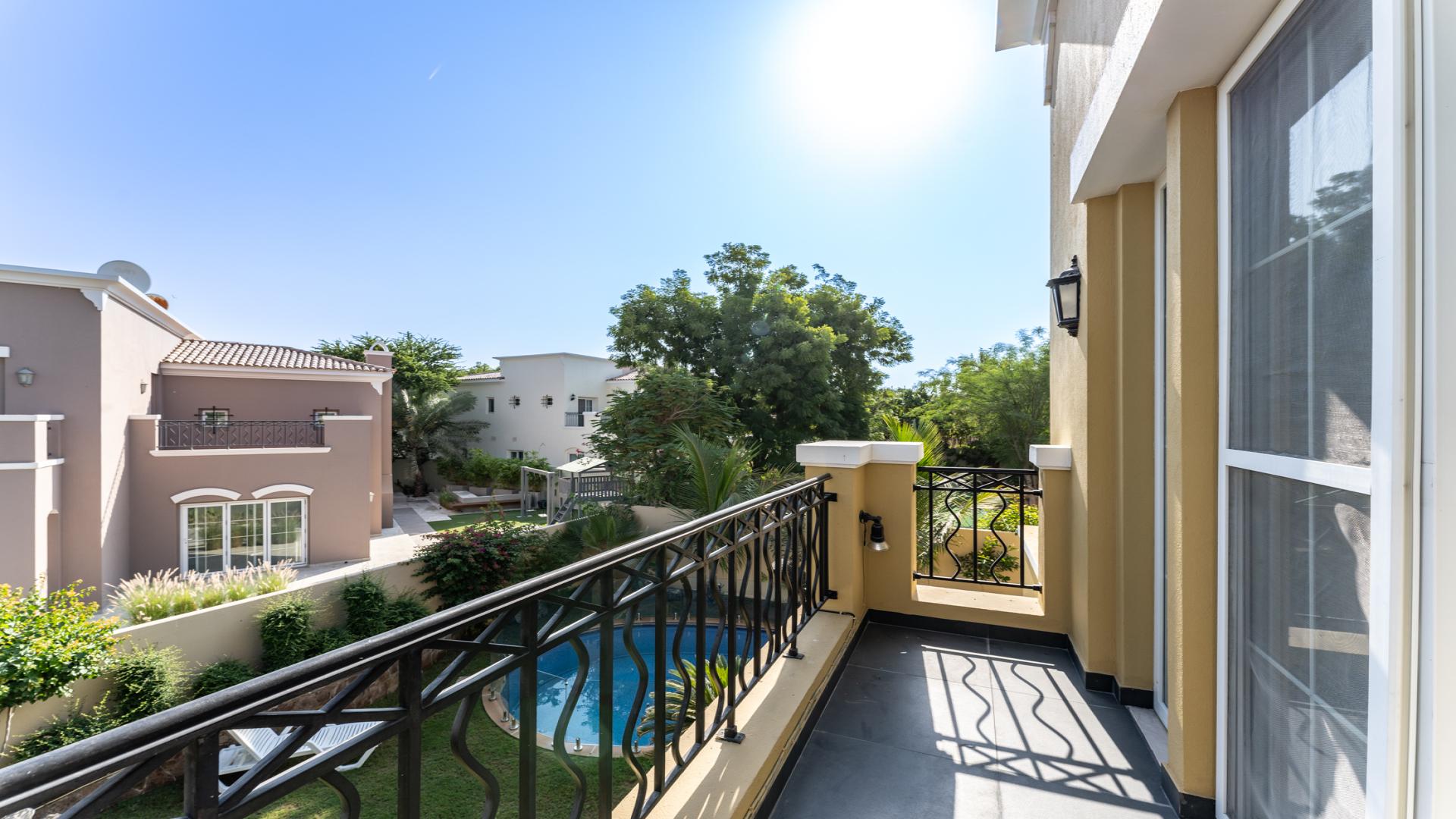 Private garden pathway with benches at 5-bedroom villa in Mirador, Arabian Ranches