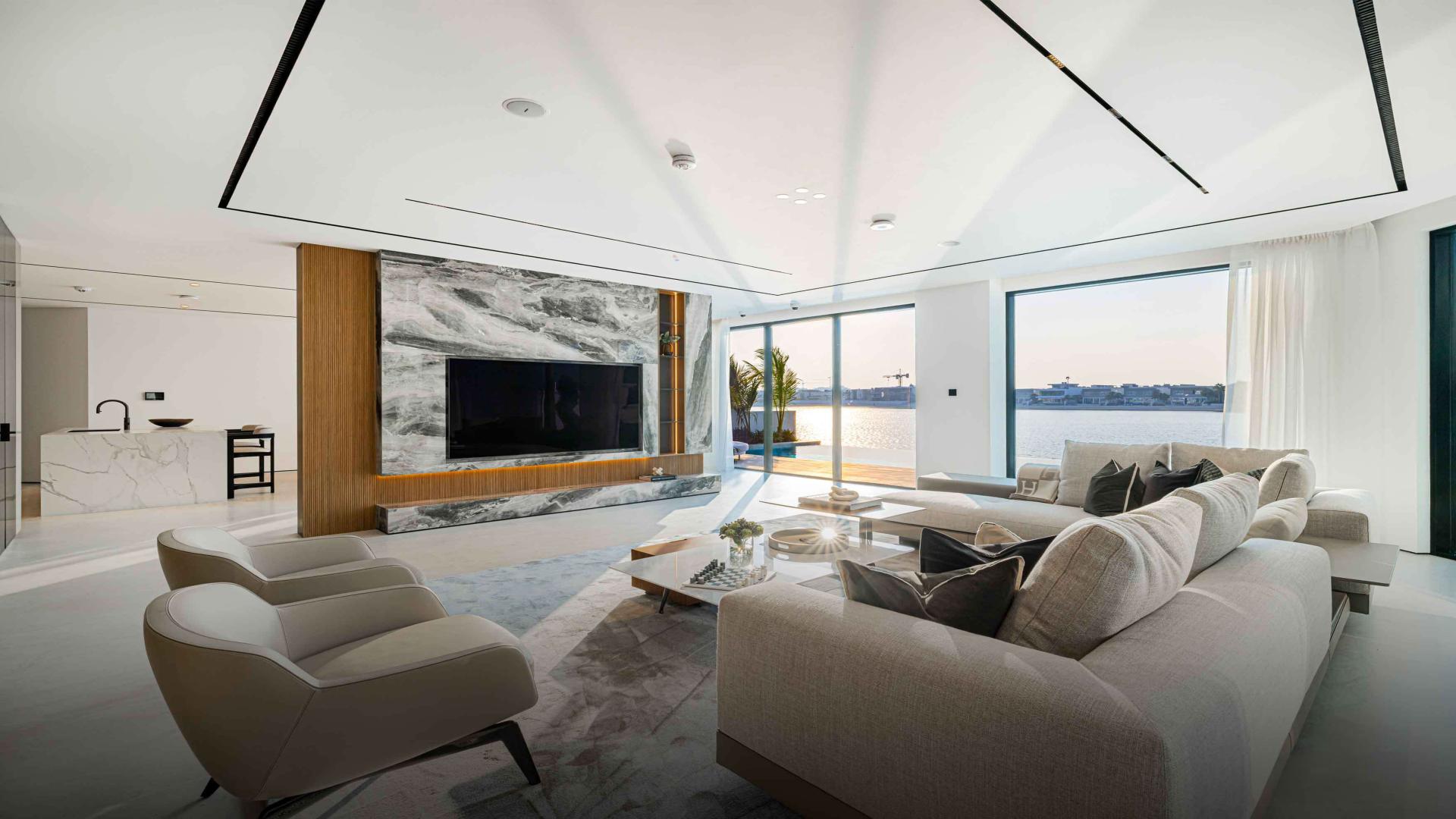 Luxurious living room in 6-bed villa, Palm Jumeirah, with pool view and modern design