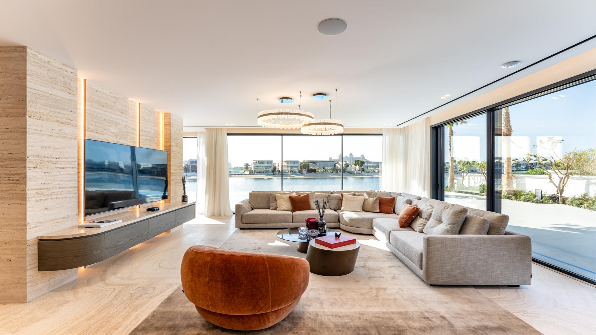 Modern beachfront villa with pool at sunset, Palm Jumeirah Garden Homes, for sale