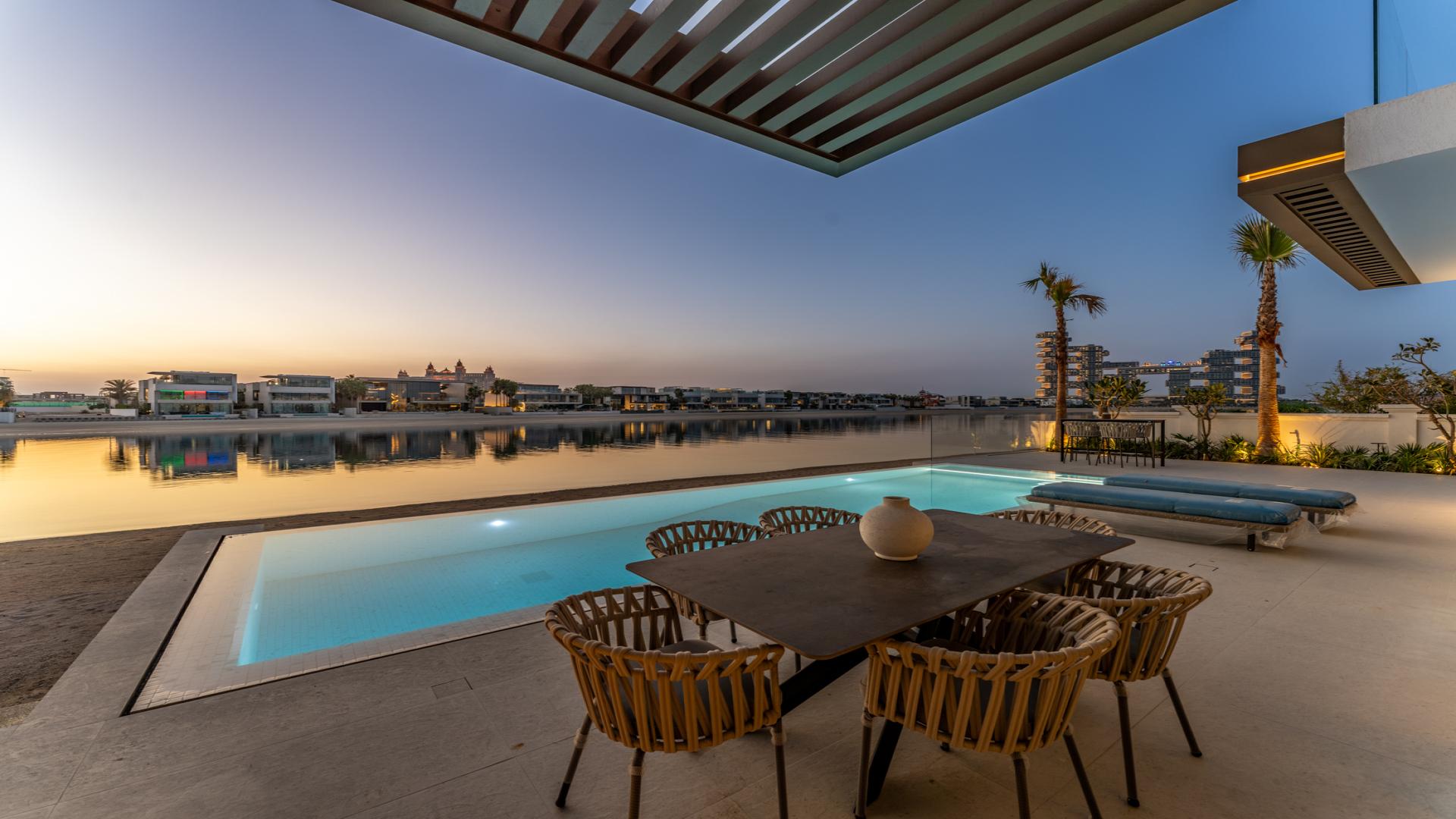 Luxurious living room in beachfront villa, Palm Jumeirah, with modern decor and sea views