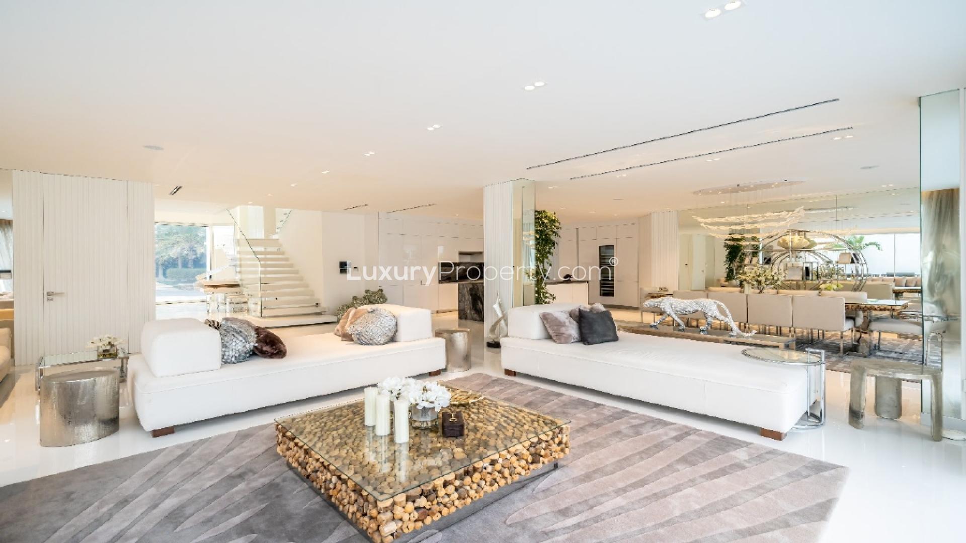 Modern white villa exterior, Palm Jumeirah Garden Homes, featuring large windows and garage
