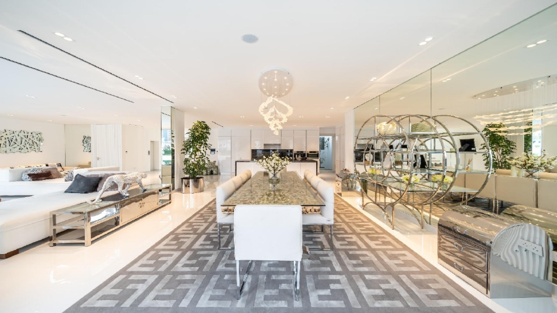 Spacious outdoor patio of luxury villa in Palm Jumeirah Garden Homes, featuring modern seating