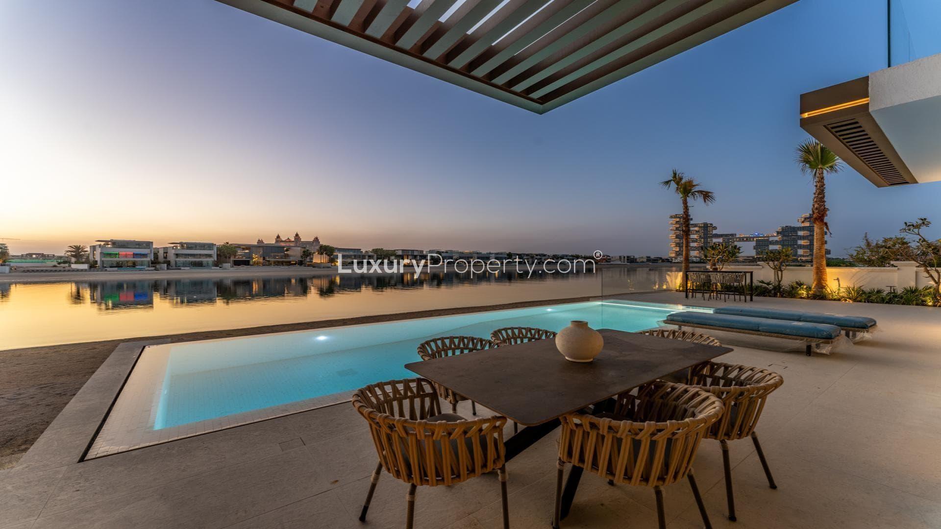 Luxurious Palm Jumeirah villa with pool, sunset views, and modern design, for sale
