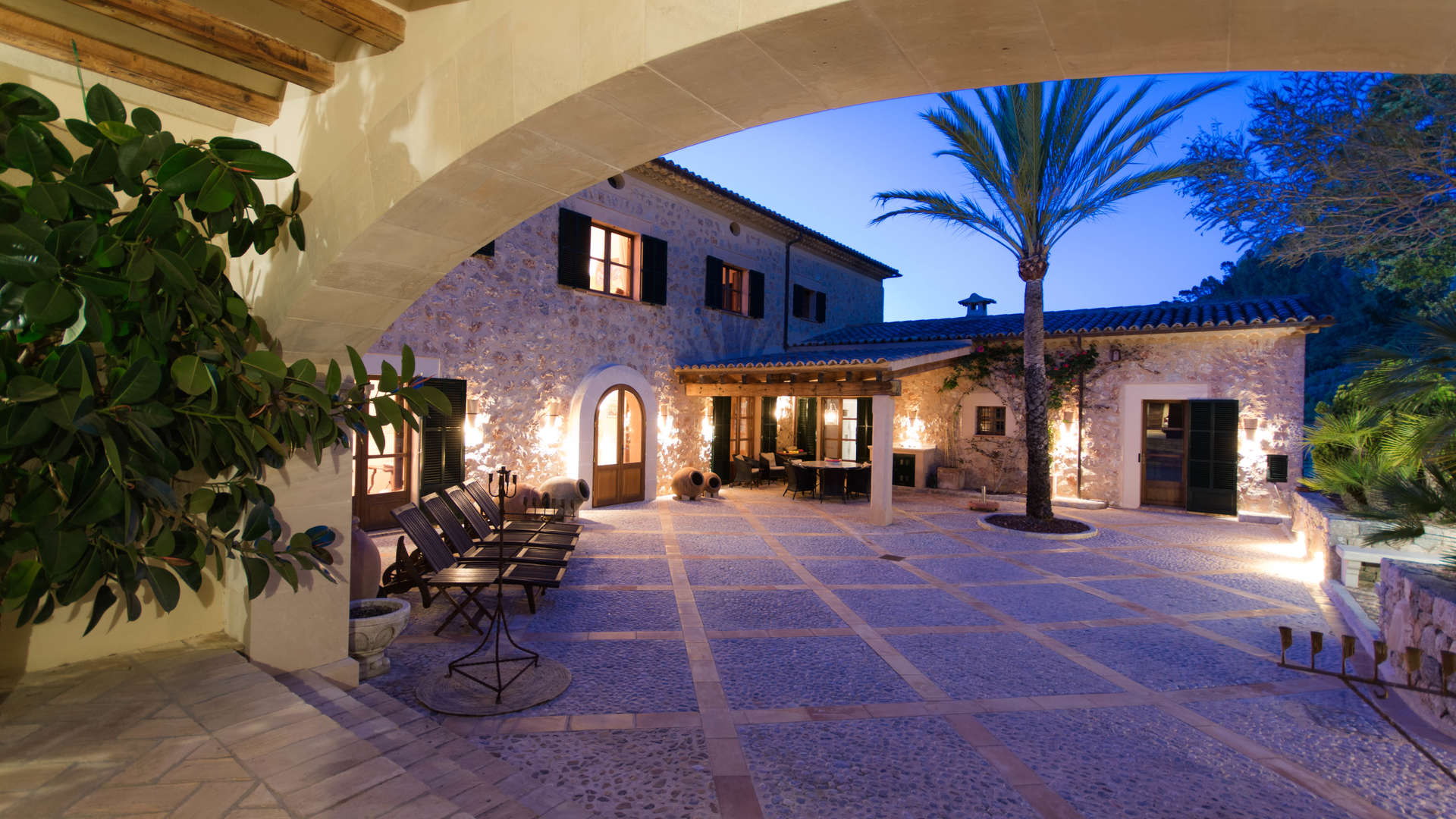 Entrance of extraordinary country house villa in North Coast Deia, Mallorca, at twilight
